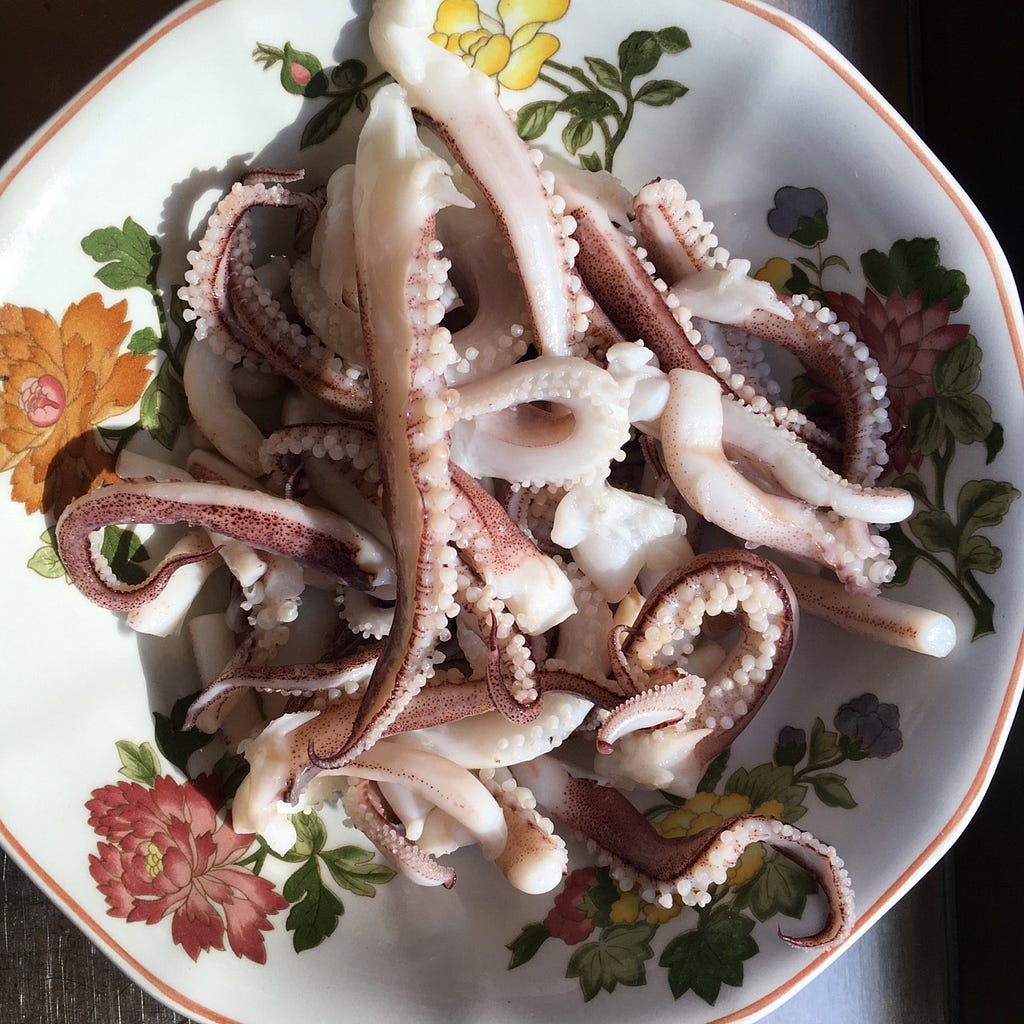 A plate with many squid tentacles.