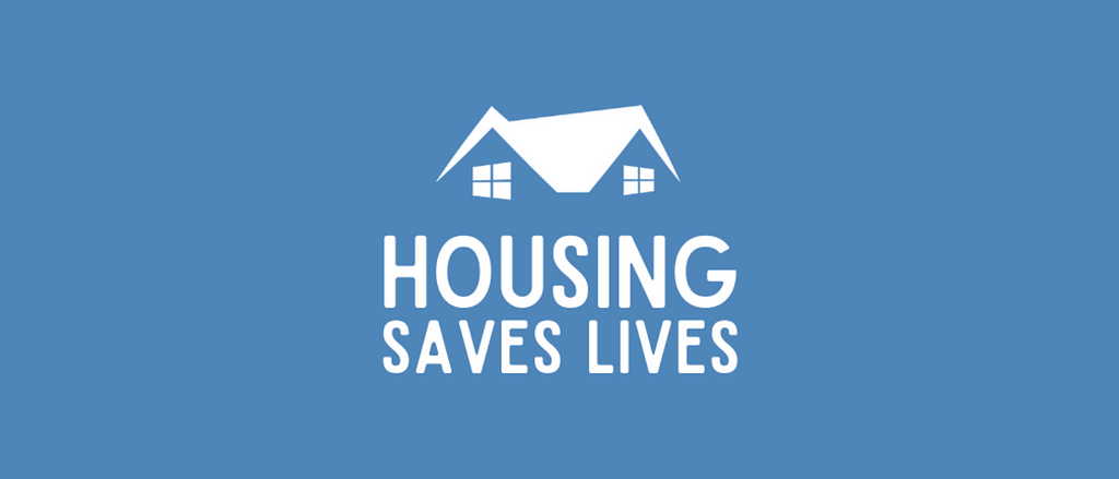 Housing Saves Lives with roof over text