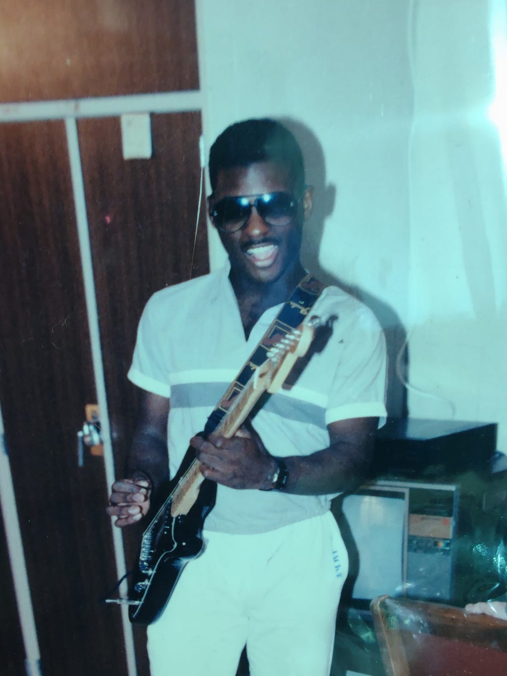 Standing pose w cherry black strat in Camp Le Jeune, N.C. — late 80s