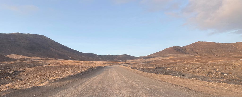 View of an open road in a desert landscape