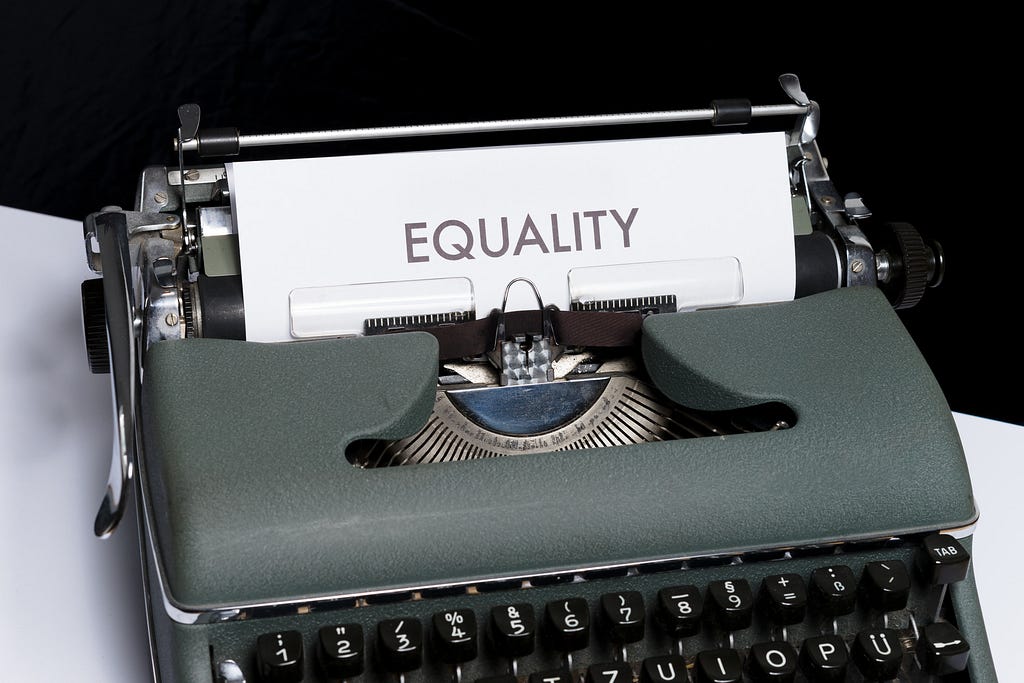 A typewriter with “EQUALITY” written on its sheet.