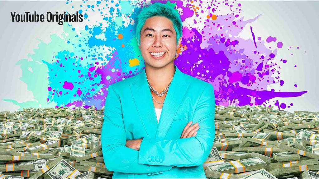 Zach ‘ZHC’ Hsieh smiling and standing in front of a pile of money.