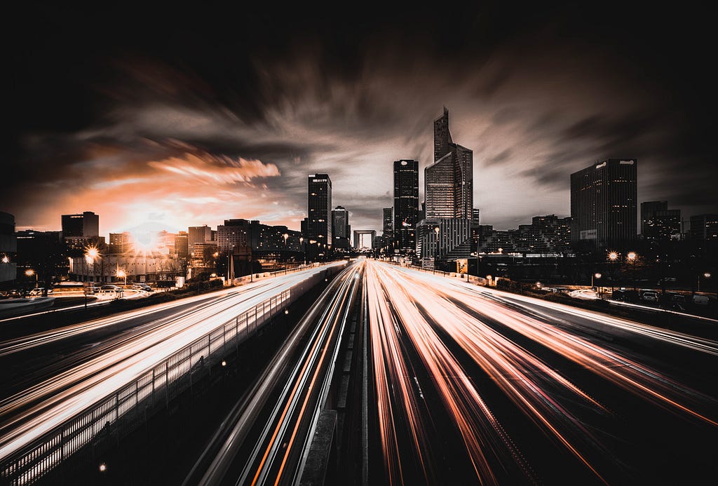 Highway with blazing fast light streaks implying quick movement