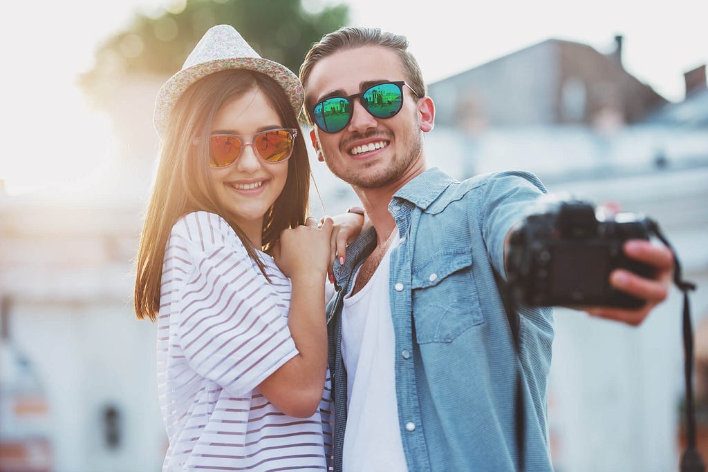 Couple Taking Selfie Having Great Vacation | xTripz — community owned and governed travel platform