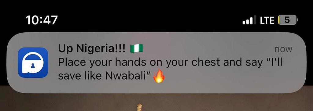 A screenshot of a phone notification from PiggyVest telling its users to save like the Nigerian goal keeper Nwabali