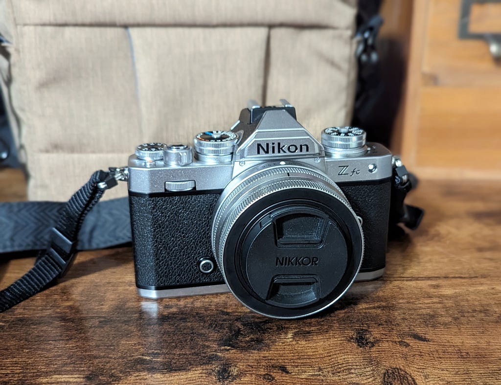 A photo of a digital camera with a black, retro-looking body