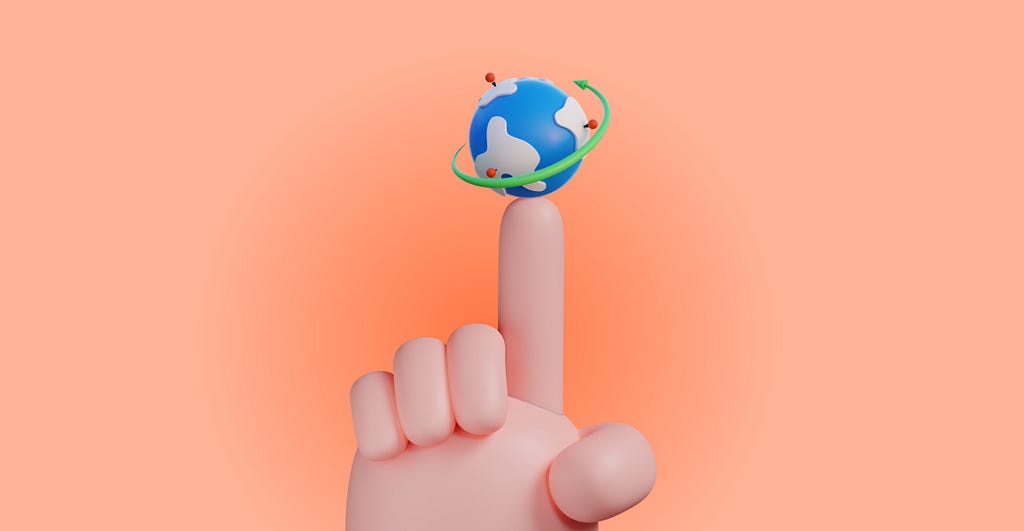 A globe sits on a fingertip