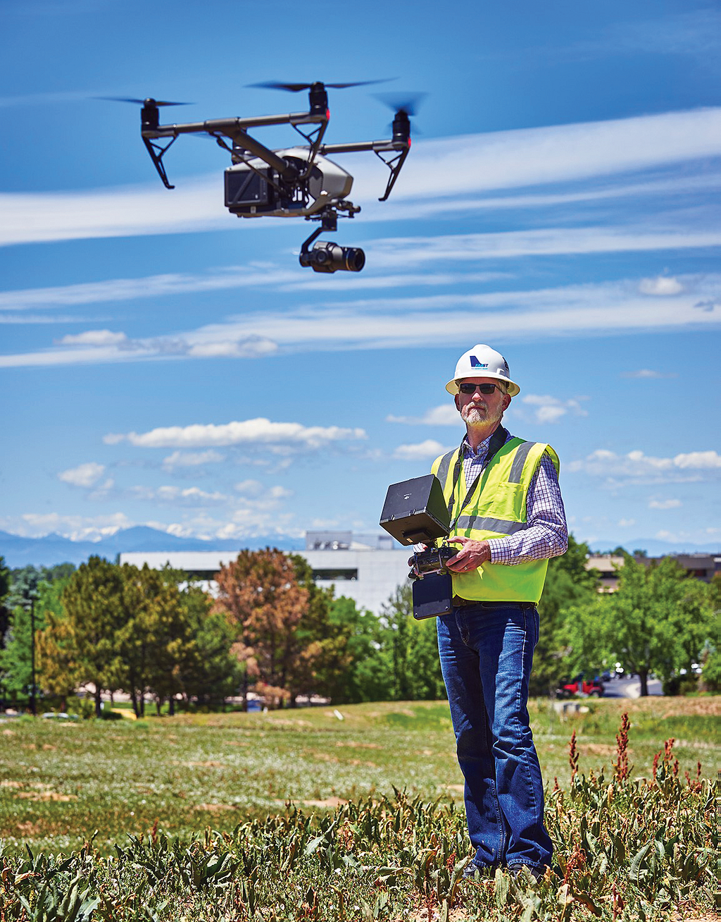 Phot of drone and remote pilot.