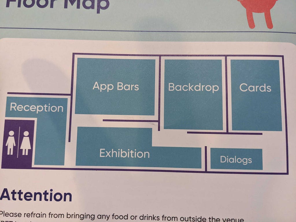 Map of DroidKaigi 2022. Reception to the left, Along the top of the map “App Bars”, ”Backdrop” and “Cards” spaces for talks can be seen in left to right order. The bottom of the map has the “Exhibition” space followed by “Dialogs” talk space from left to right.