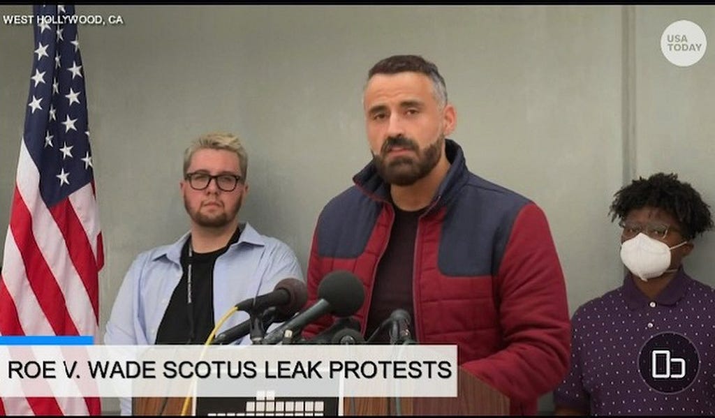 Stonewall President Alex Mohajer speaks at Roe Rally