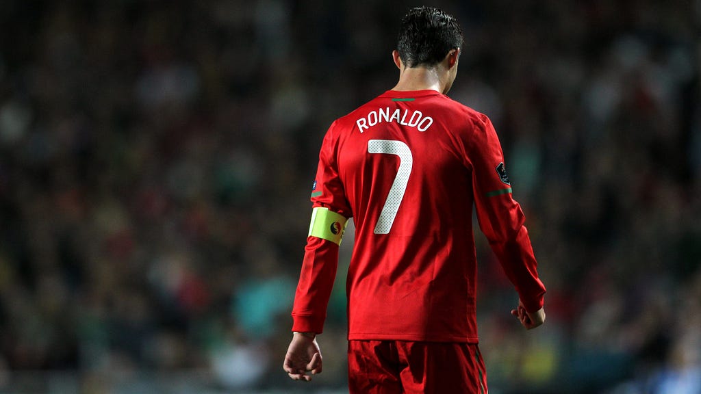 View from Cristiano Ronaldo’s back wearing a red football jersey #7
