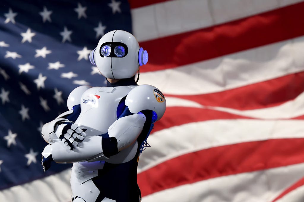 A robot posing in front of the US flag