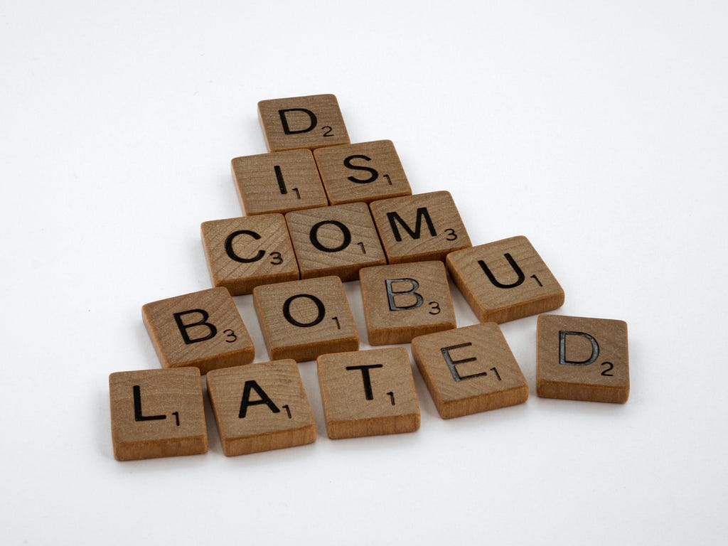 A picture showing the word discombobulated in scrabble tiles