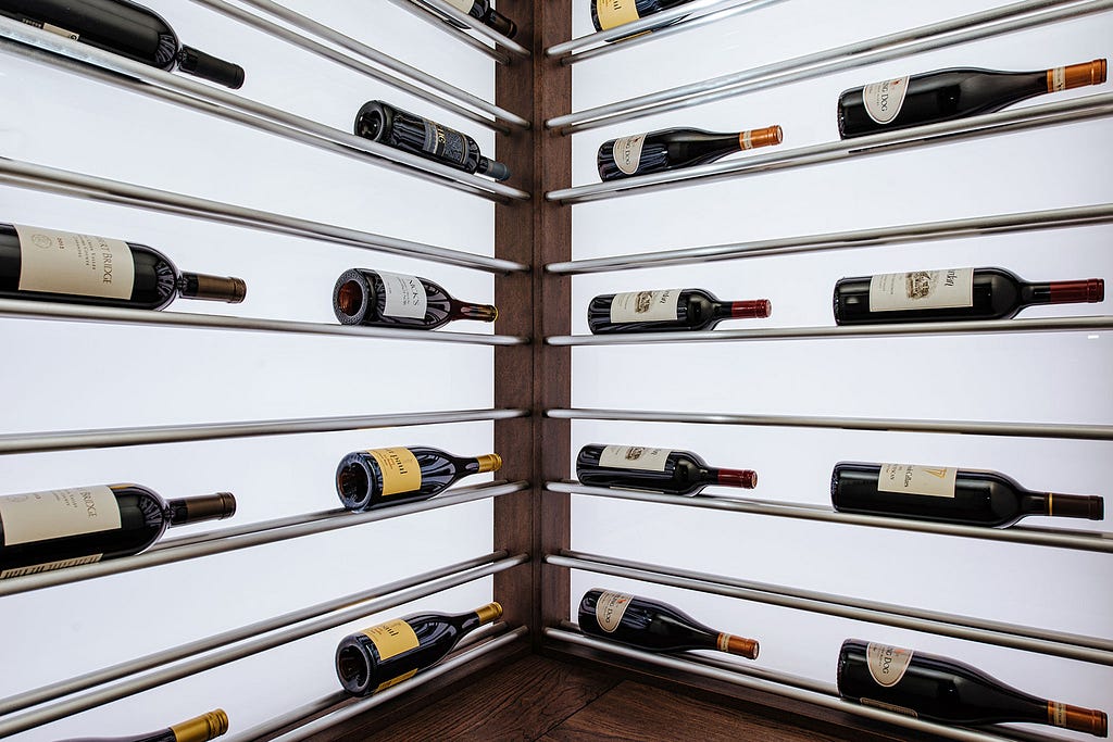 Bottles take center stage in this modern wine cellar design by Sommi Wine Cellars.