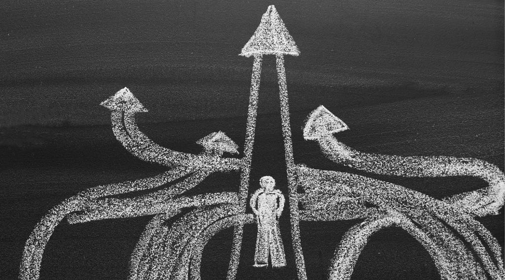 Blackboard drawing: a man choosing different directions