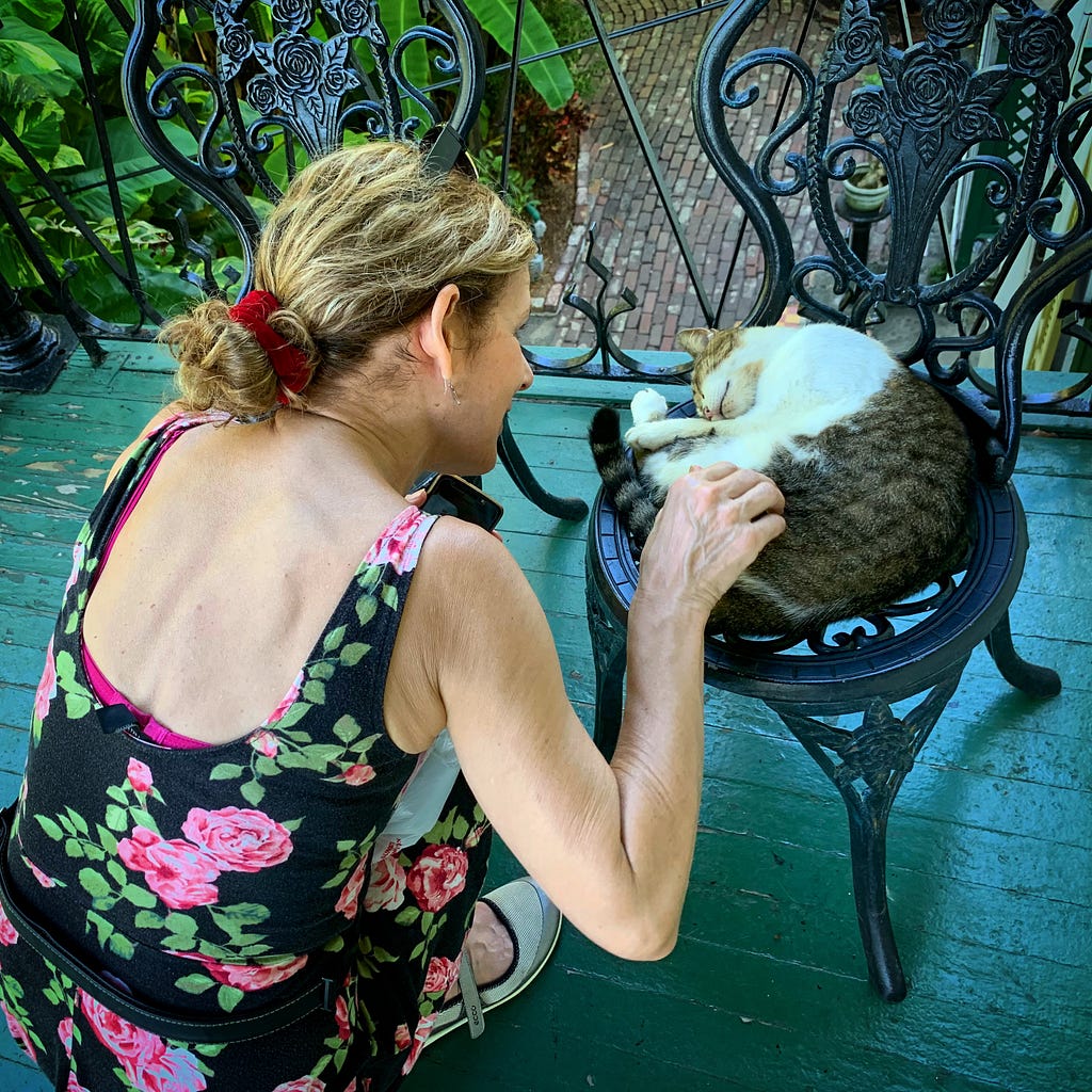 M.E. petting a polydactylpuss — one of several six-toed cats that live at Hemingway’s House