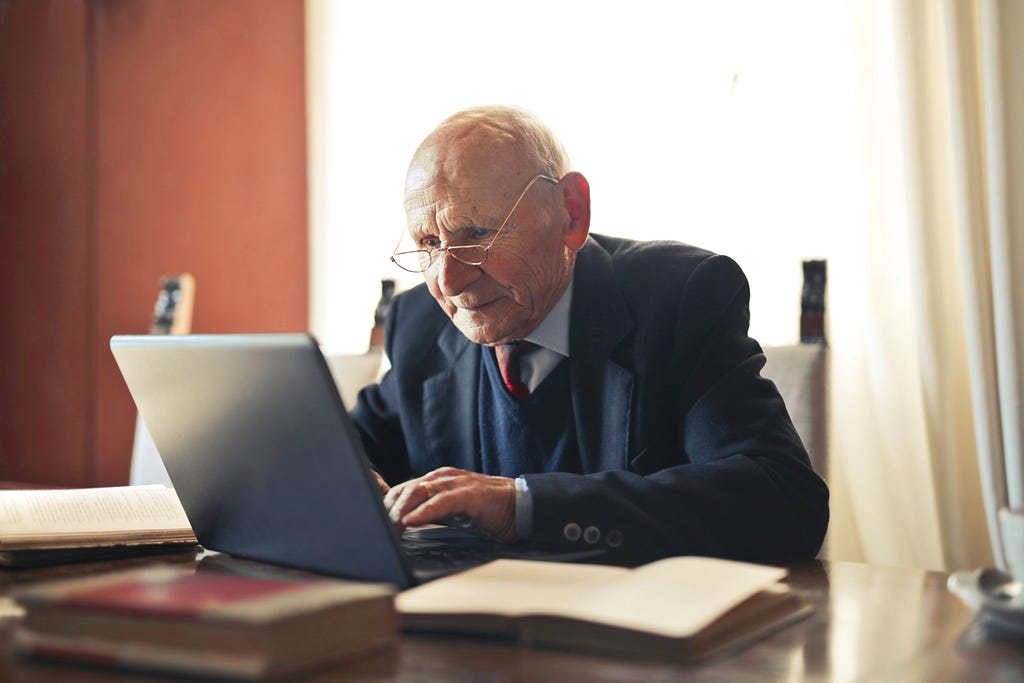 Old man with a computer