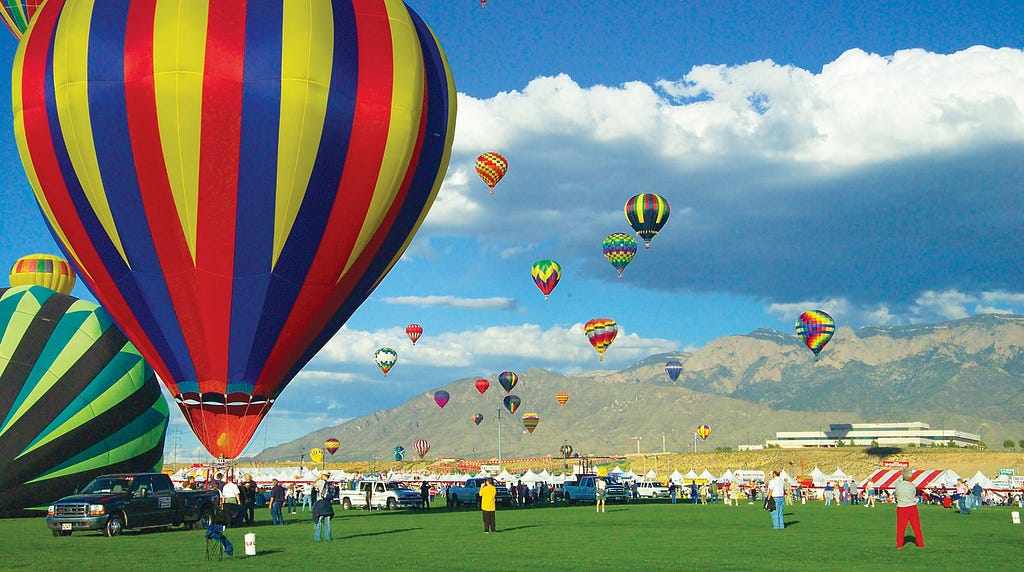 Photo of hot air balloons taking off.