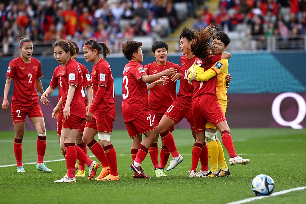 photo of Vietnam players celebrating a save by their goalkeeper