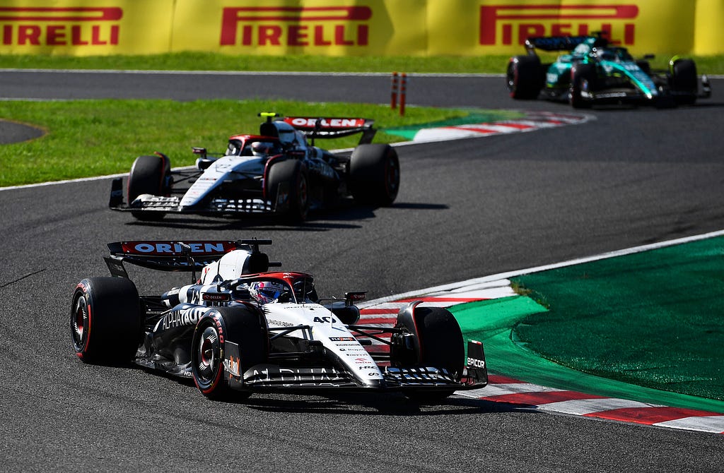 Yuki Tsunoda and Liam Lawson follow each other closely at Suzuka.