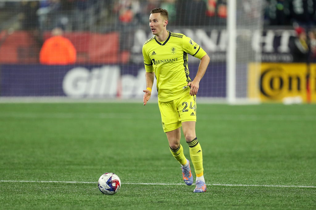 Mar 18, 2023; Foxborough, Massachusetts, USA; Nashville SC midfielder Jan Gregus (24) possesses the ball during the second half against the New England Revolution at Gillette Stadium. Credit: Paul Rutherford-USA TODAY Sports