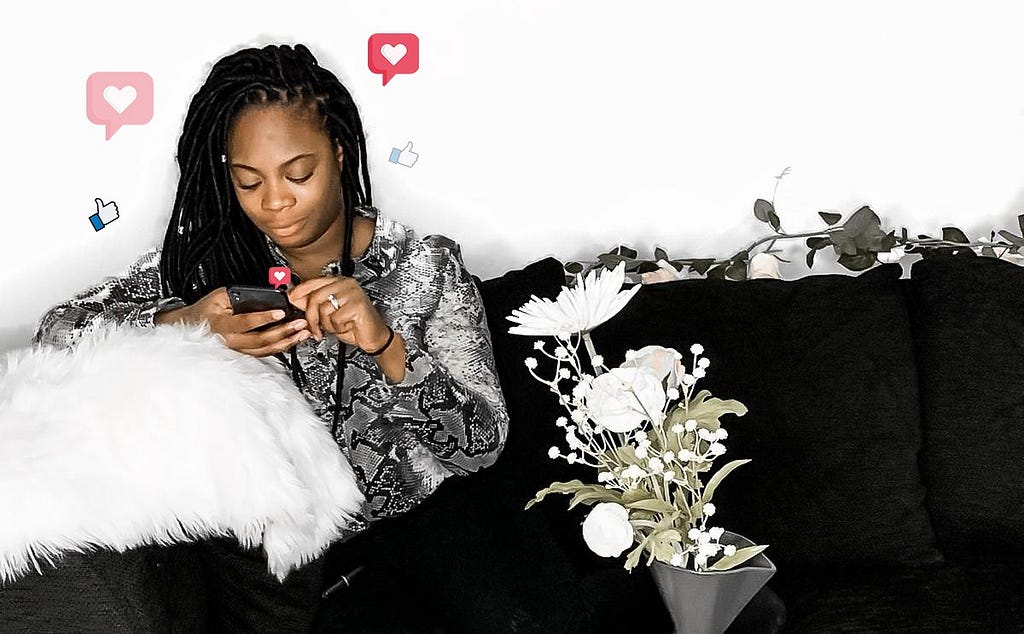 A woman sitting on a couch using her mobile phone with Instagram hearts and Facebook thumbs-up animation floating around her