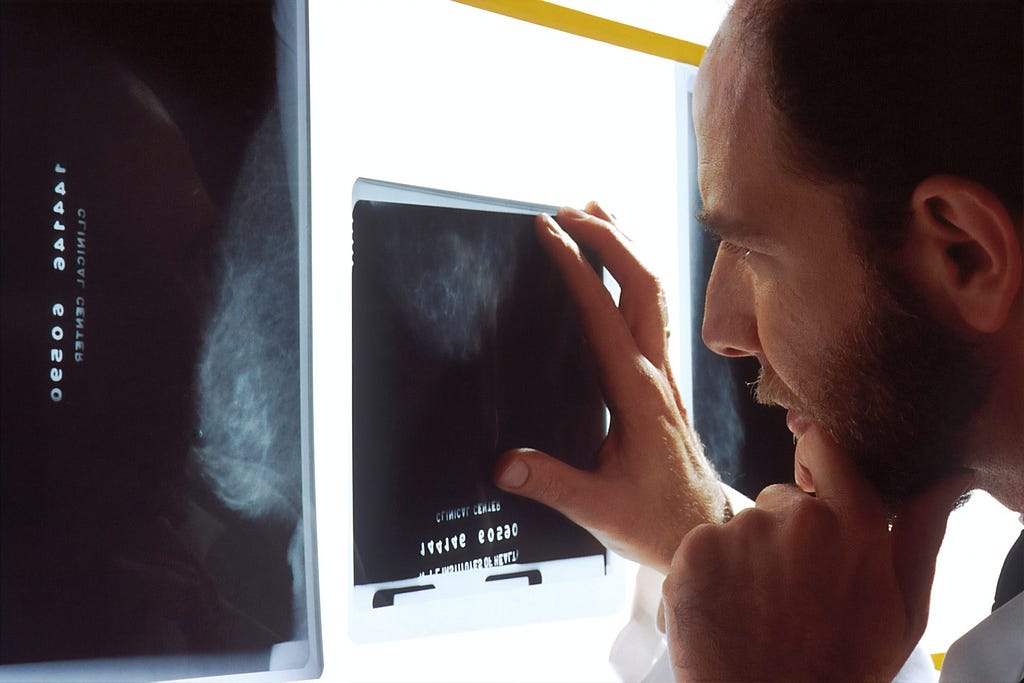 A medical doctor analysing a cancer scan