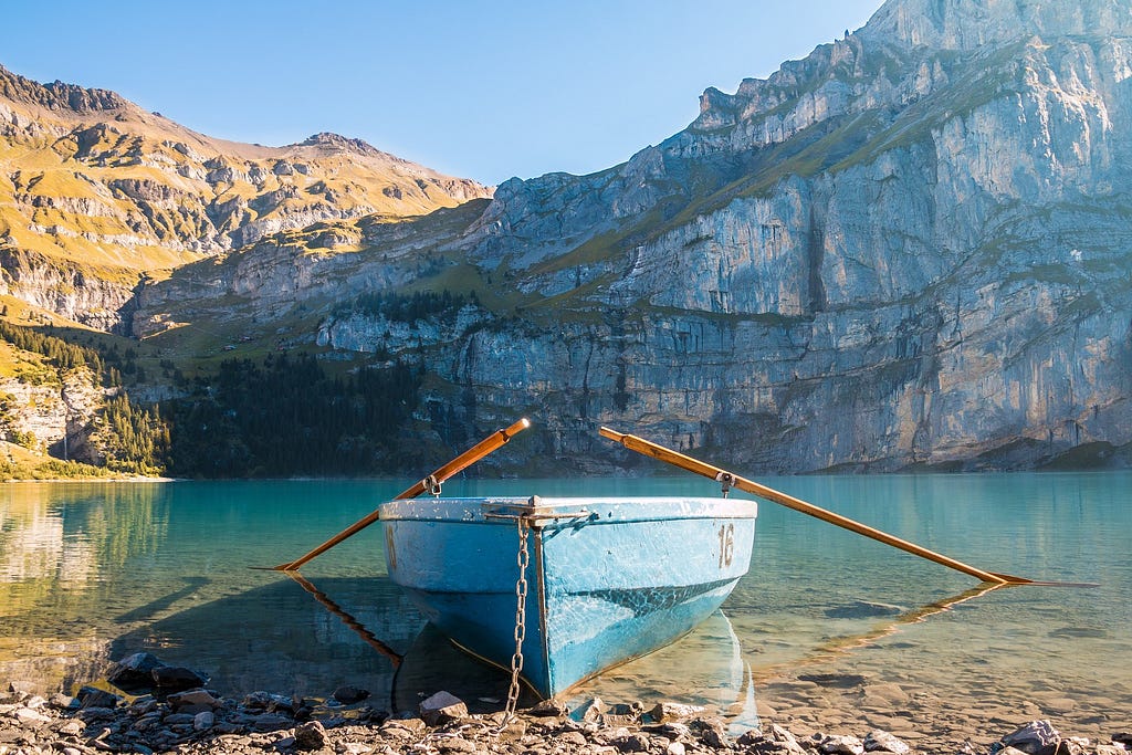 row boat in mountain lake