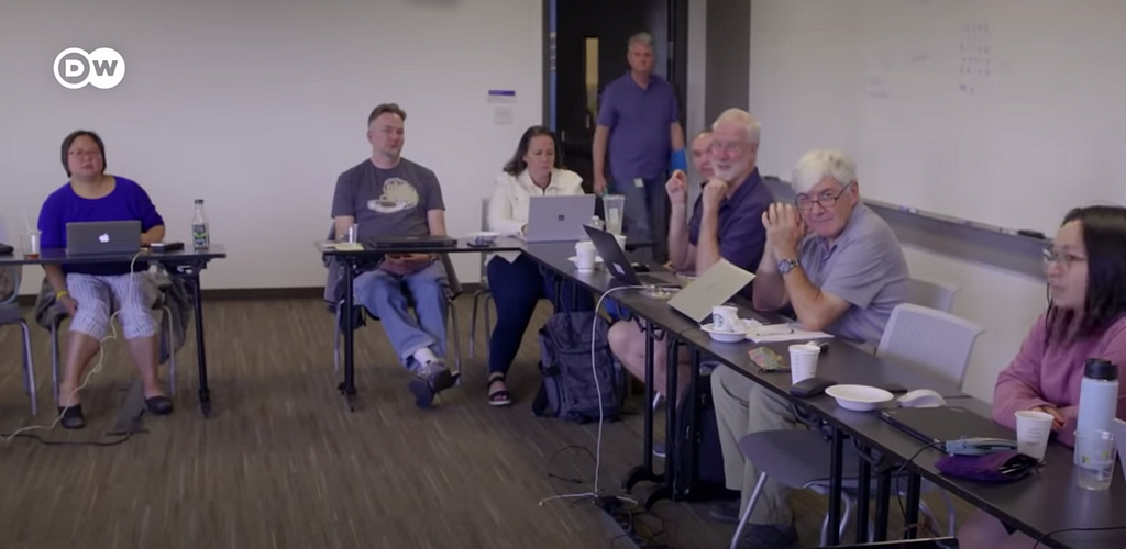 Emoji Committee meeting room with mostly old white males