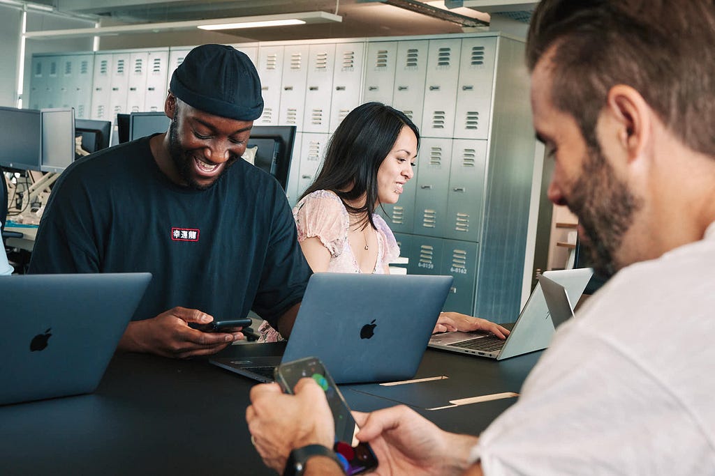 Image of three of our Technology team members at ASOS collaborating.