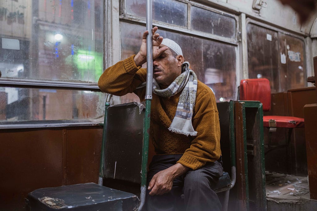 View of an unidentified man as he tired after a long day inside a tram, Alexandria, Egypt, April 5, 2019.