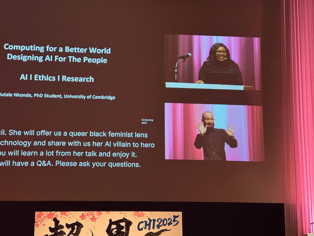 A slide “Computing for a Better Word, Designing for All People”.