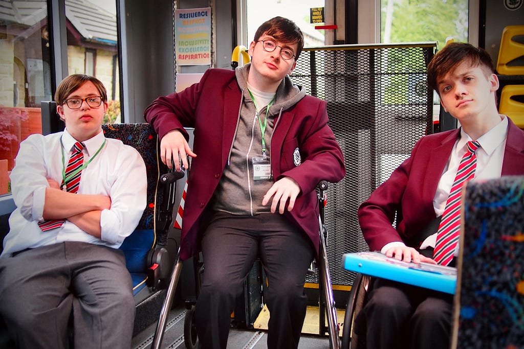 Ruben Reuter, Jack Carroll and Zak Ford-Williams in character as Dan, Mike and Sonny on the Mobility bus