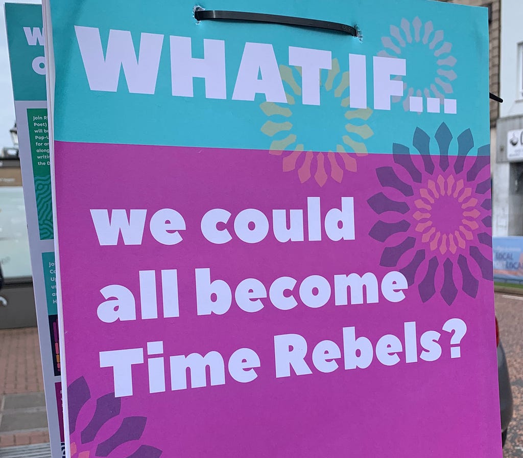 Blue and Pink poster with the words WHAT IF … we could all become Time Rebels?