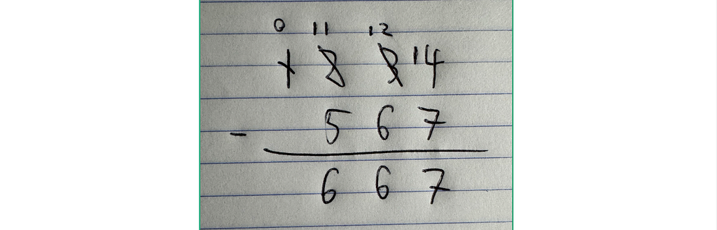 Author performing 1234 - 567 = 667 on a piece of paper.