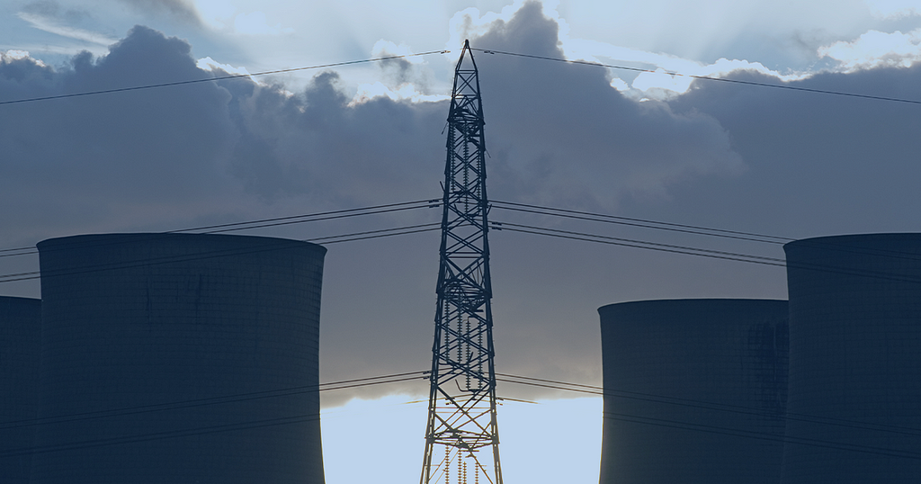 picture showing cooling stacks at a power stations and electrical power lines