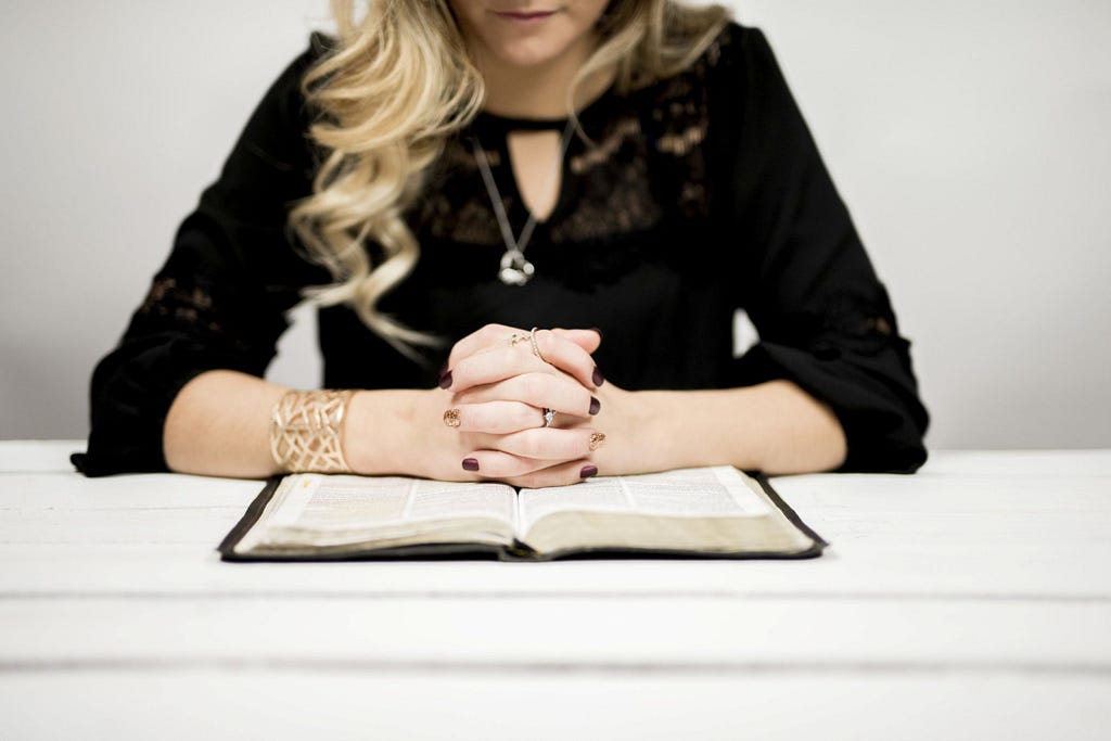 A woman reading the Bible.