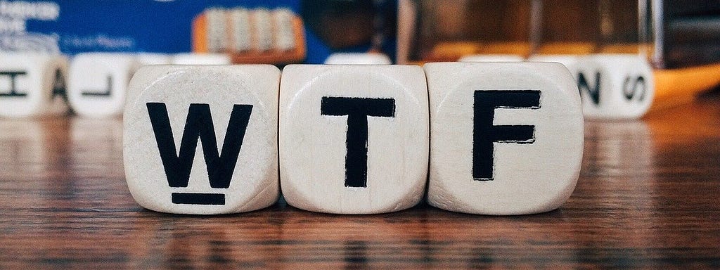 Image showing close up of Boggle cubes, namely the letter W, T, and F.