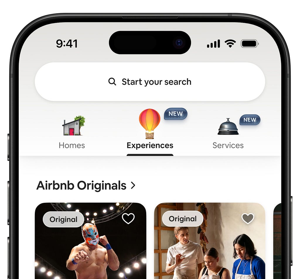 Close-up of the Airbnb mobile app interface showing a redesigned top navigation bar with icons for Homes, Experiences, and Services.