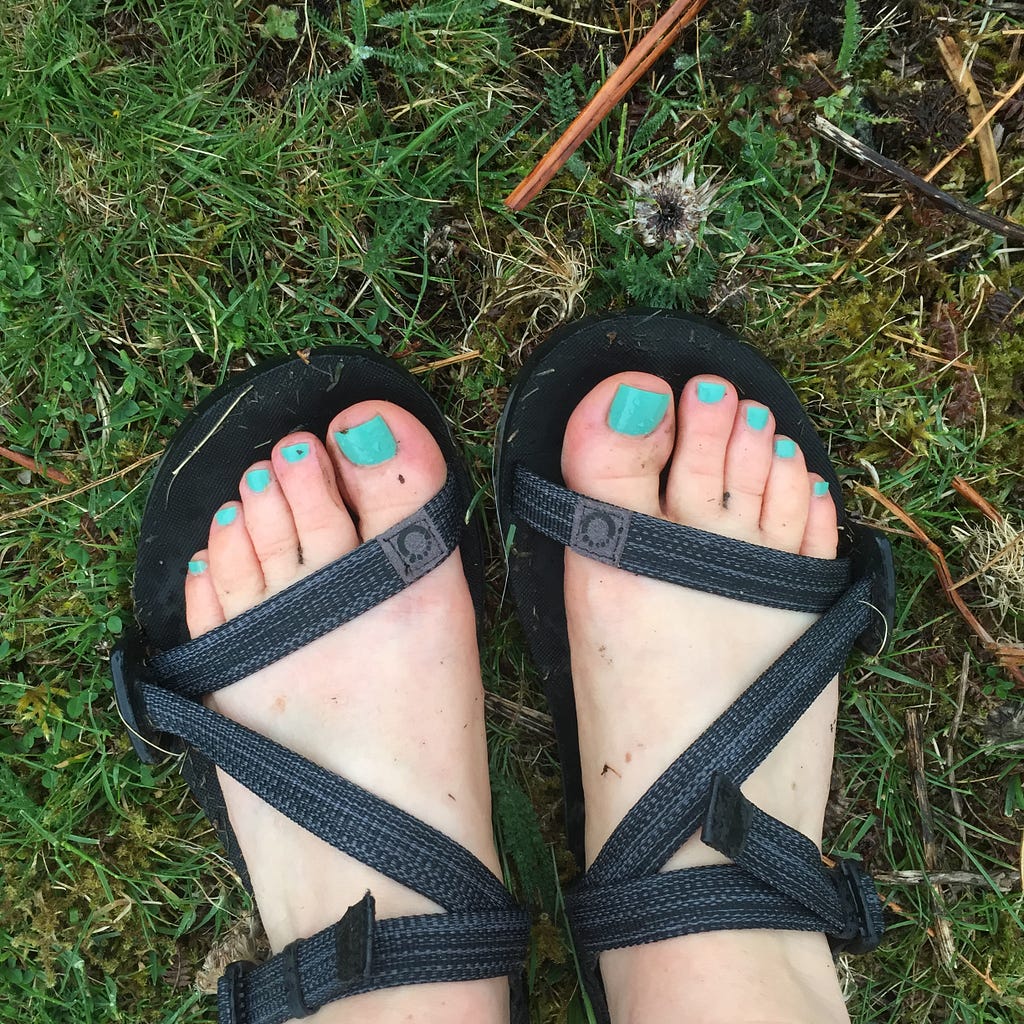 muddy, happy feet in sandals on a cold day
