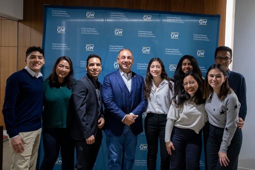 Congressman Gil Cisneros stands with Scholars from the Cisneros Hispanic Leadership Institute