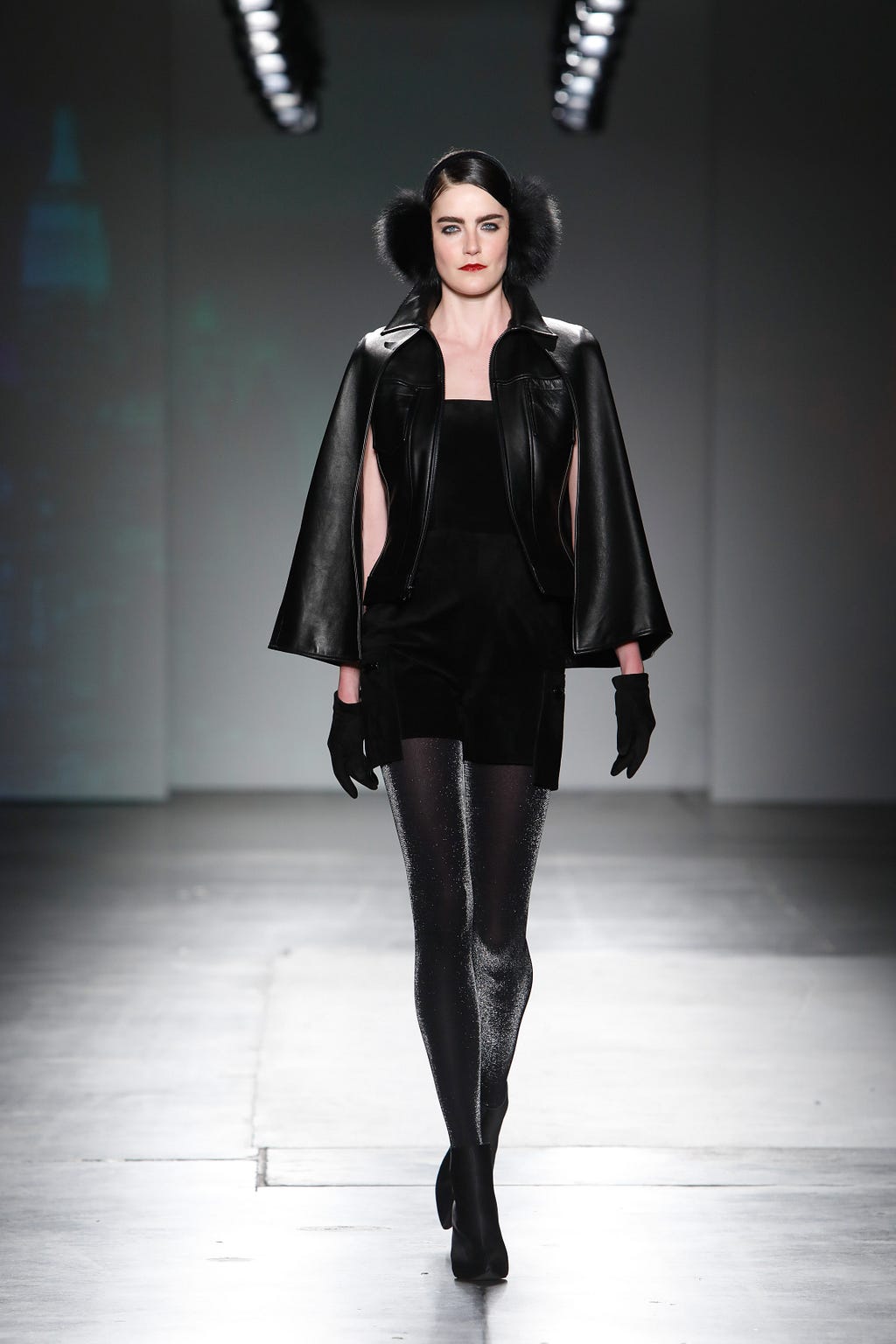 Opening Look — Black French Lacquer Leather Capelet Jean Jacket with Black French Suede Strapless Jumpshort with Drop-Pocket