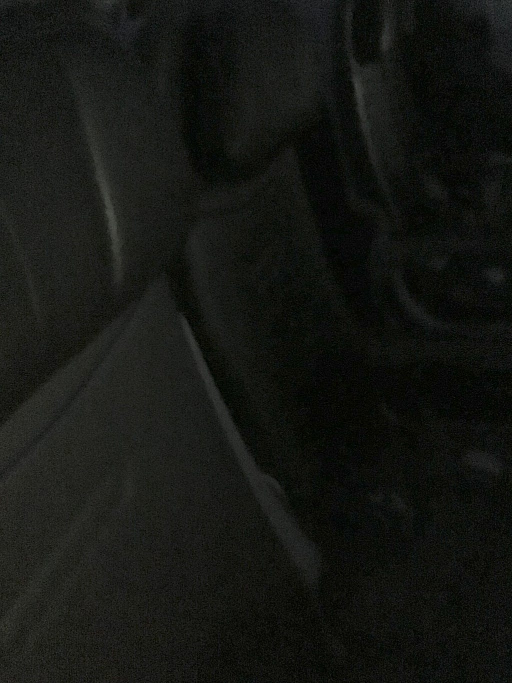 Two empty airplane seats in the dark