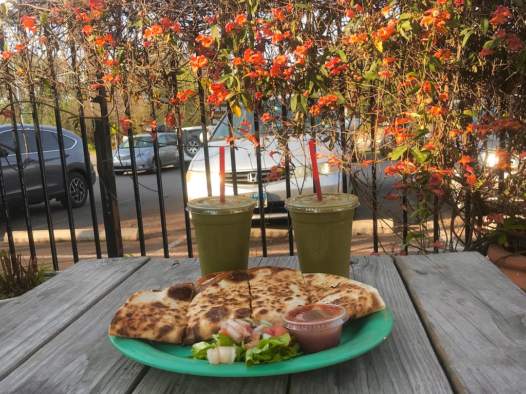 A quesadilla and two green smoothies from Cherrywood Coffeehouse