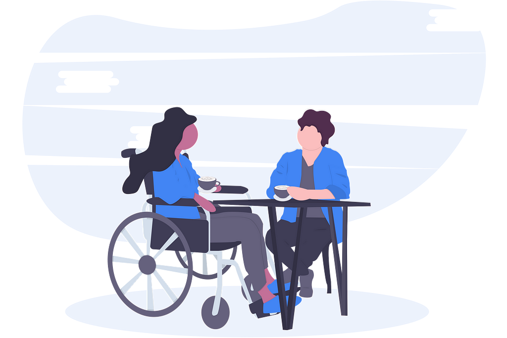 A woman in a wheelchair having coffee with a friend