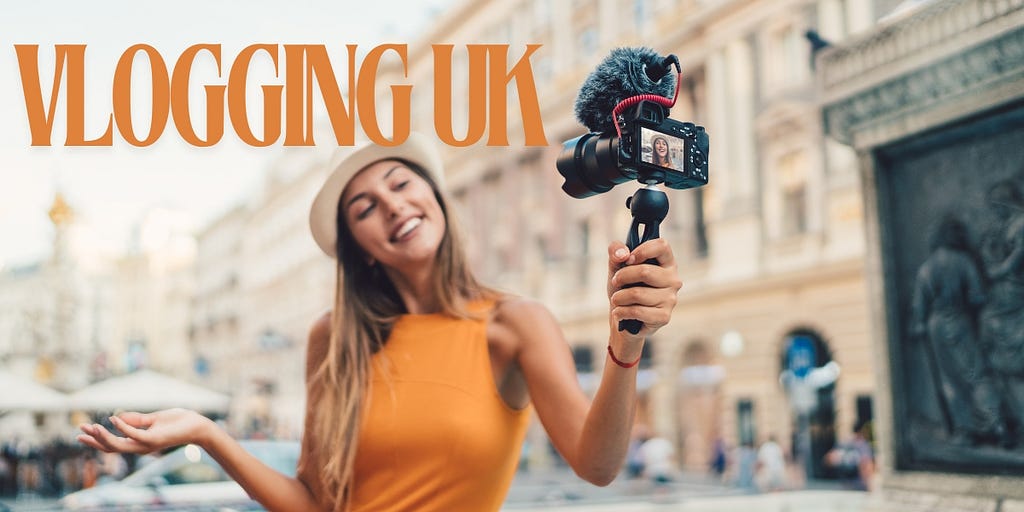 IMAGE OF A WOMAN IN AN ORANGE TOP HOLDING A CAMERA ON A GIMBAL STABILISER WHILE VLOGGING