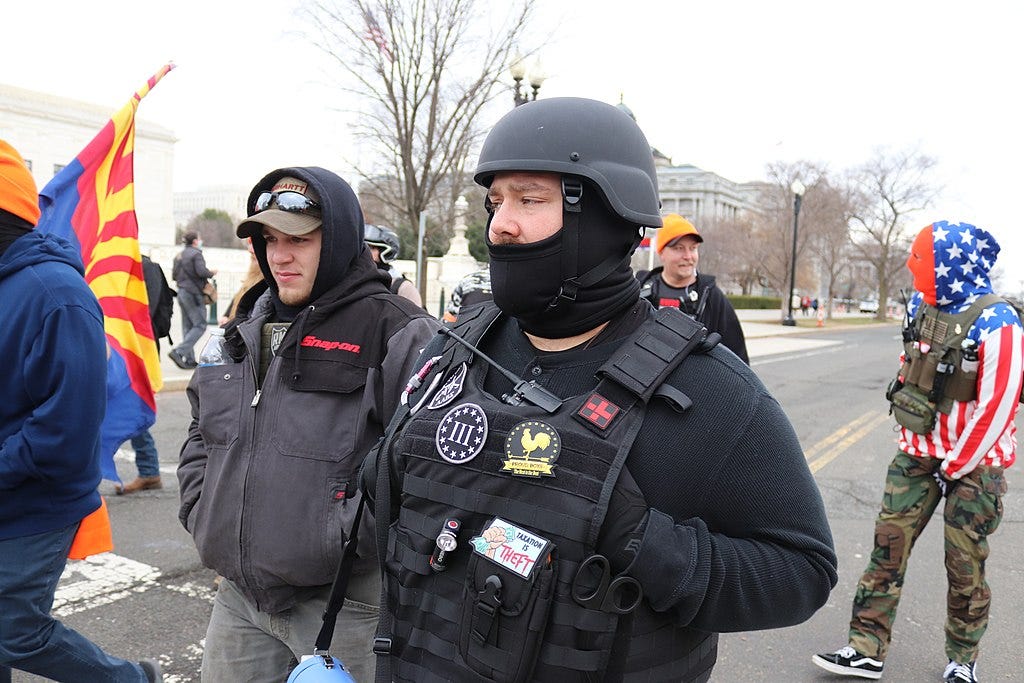 Proud Boys militant with anti-riot equipment- Elvert Barnes from Silver Spring MD, USA, CC BY-SA 2.0, via Wikimedia Commons.