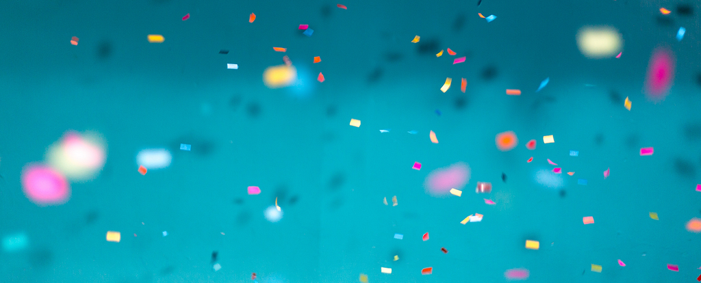 Paper colourful confetti floating in the air