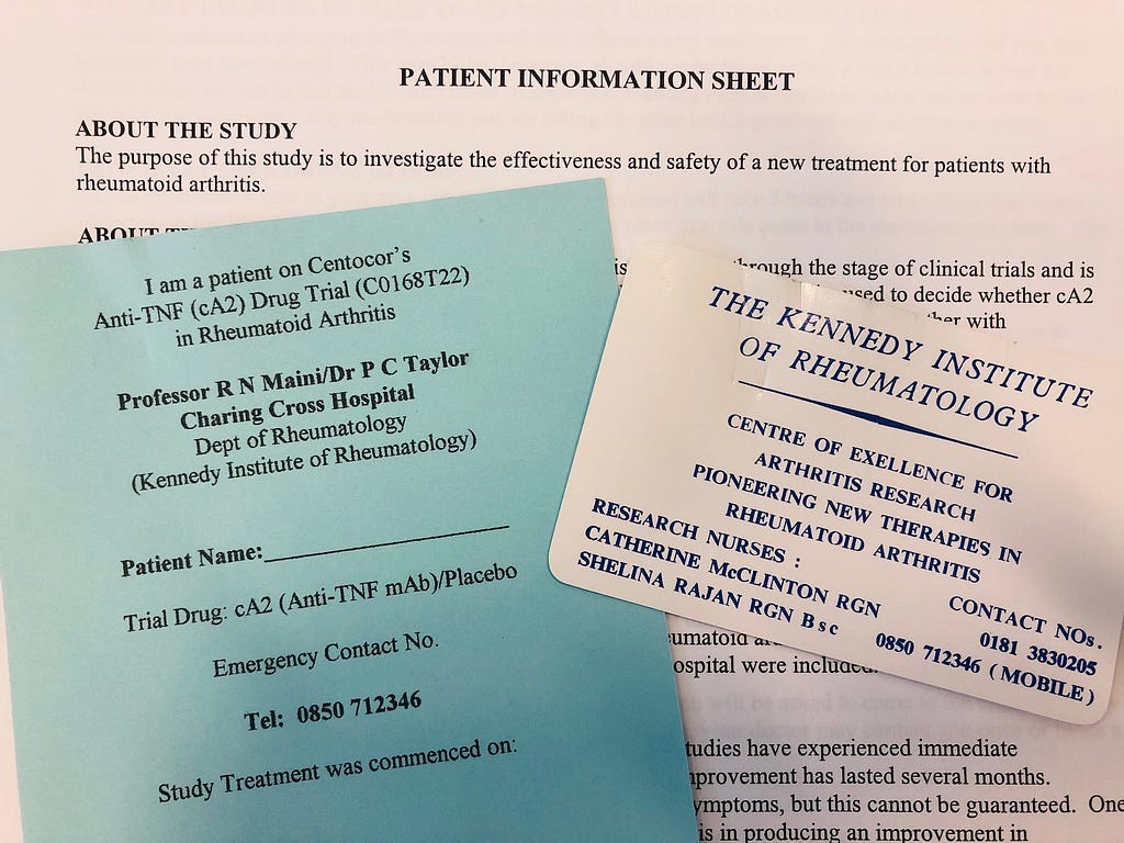 Collage of Blue and white documents including a patient information sheet, a card to say a patient is taking part in a clincial study and a Kennedy Institute contact card.