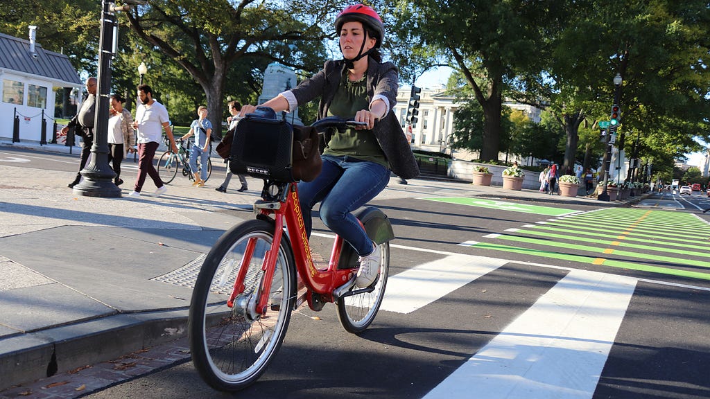 A person rides a Capital Bikeshare bicycle in Washington, D.C.